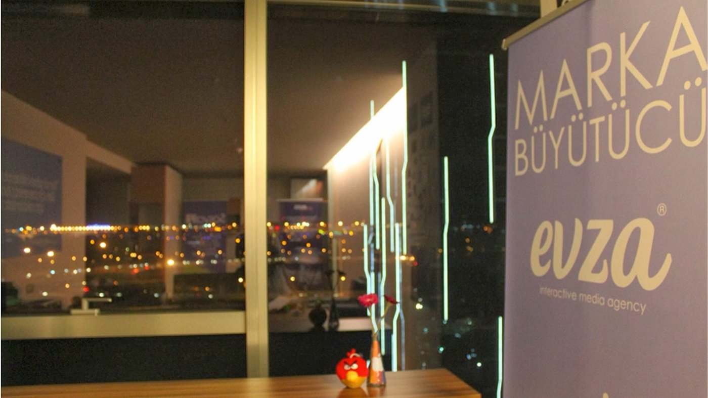 The Evza office at night with a Marka Büyütücü banner